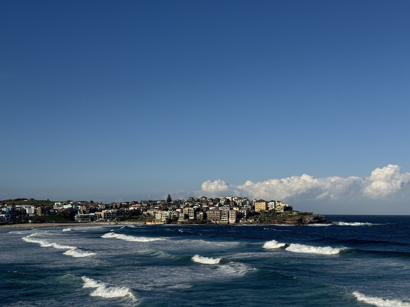 Waves rolling into a beach town